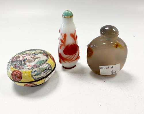 Lot 30 - A Chinese Canton enamel small boy and dog box and cover, Qing Dynasty 18/19th century