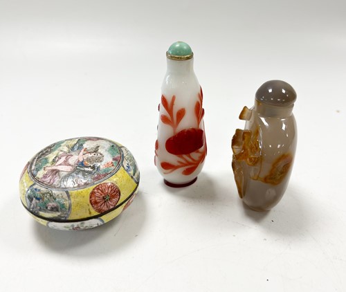 Lot 30 - A Chinese Canton enamel small boy and dog box and cover, Qing Dynasty 18/19th century