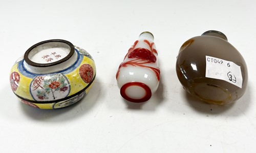 Lot 30 - A Chinese Canton enamel small boy and dog box and cover, Qing Dynasty 18/19th century