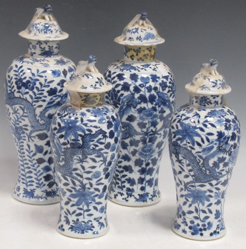 Lot 33 - A pair of Chinese blue and white lidded vases...