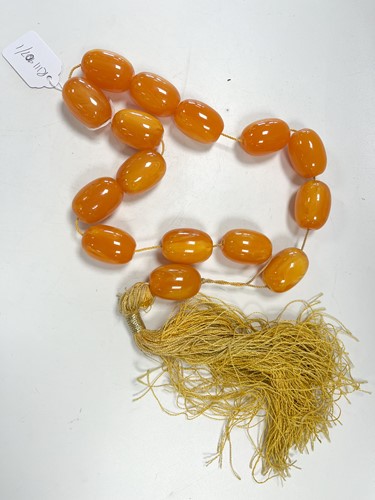 Lot 171 - An amber bead necklace, consisting of fifteen...