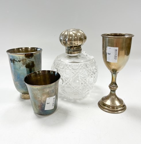 Lot 188 - A silver stirrup style cup, a silver miniature...