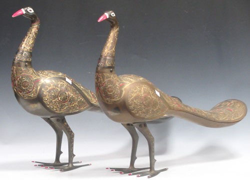 Lot 73 - Two Indian brass peacocks, decorated with...