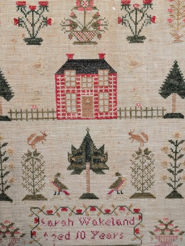 Lot 128 - A Victorian needle work sampler, depicting a...