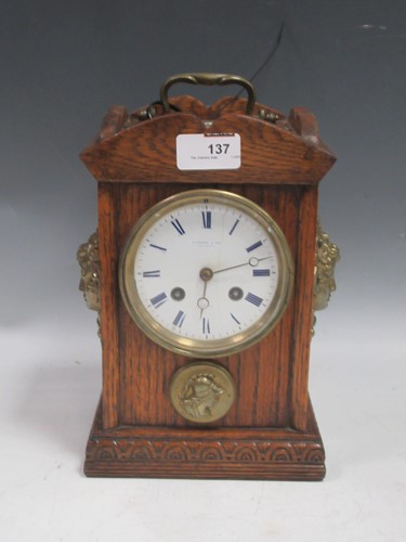 Lot 137 - A French oak cased 8-day striking mantel clock...