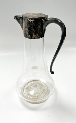 Lot 195 - A silver topped glass claret jug