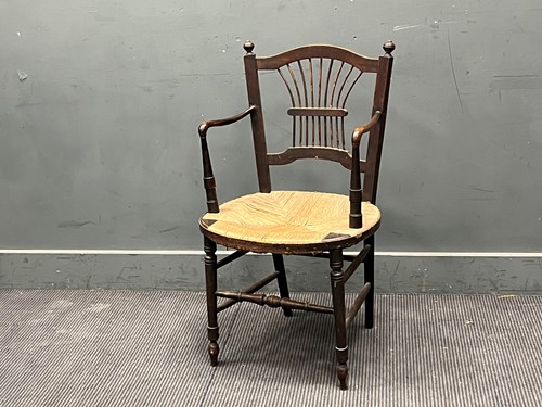 Lot 368 - An Arts & Crafts armchair with rush seat