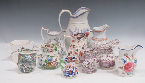 Lot 68 - A group of 19th century pottery jugs, the...
