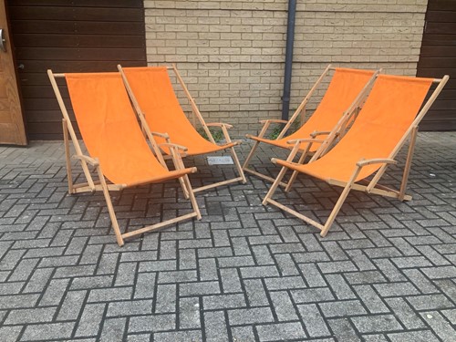 Lot 487 - A set of four contemporary beech-framed deck chairs
