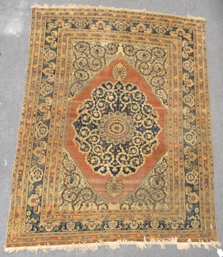 Lot 457 - A Tabriz rug with central medallion on a rust...