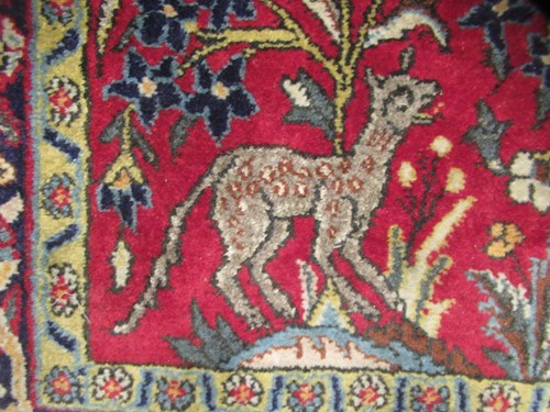 Lot 454 - A Tabriz tree of life rug birds and animals on...