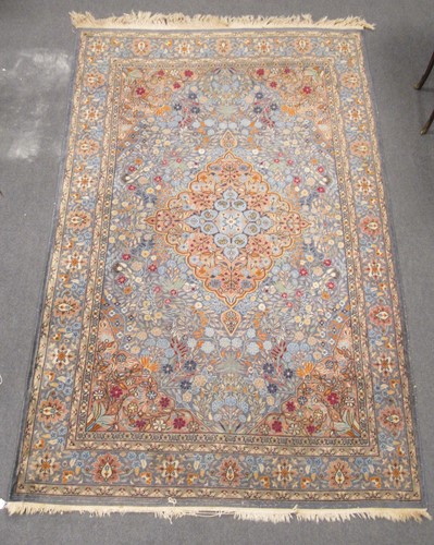 Lot 455 - A Tabriz rug with central medallion on a blue...