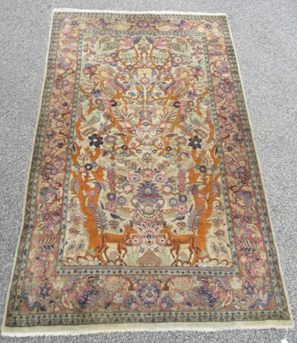 Lot 554 - A Persian hunting design Qum rug