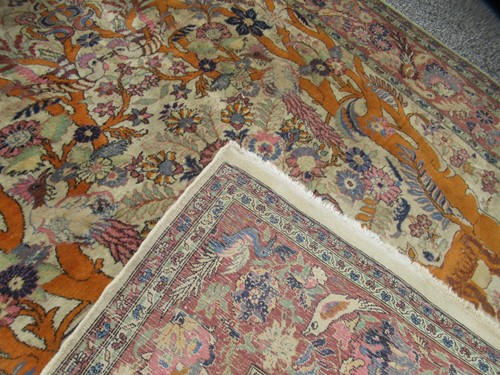 Lot 554 - A Persian hunting design Qum rug