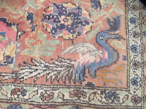 Lot 554 - A Persian hunting design Qum rug