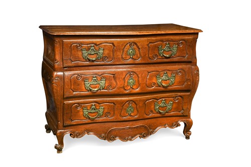 Lot 387 - A Louis XV provincial walnut commode