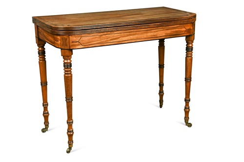 Lot 518 - A late Regency mahogany and crossbanded fold over tea table