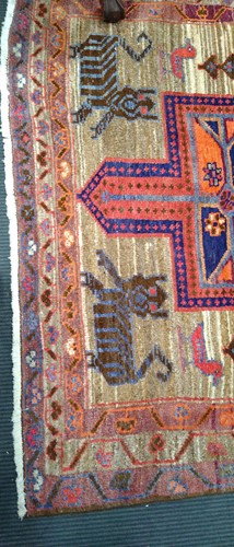 Lot 453 - A Caucasian rug, with three central medallions...