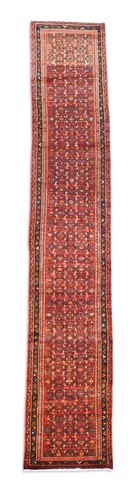 Lot 579 - A Persian red ground runner, late 20th century
