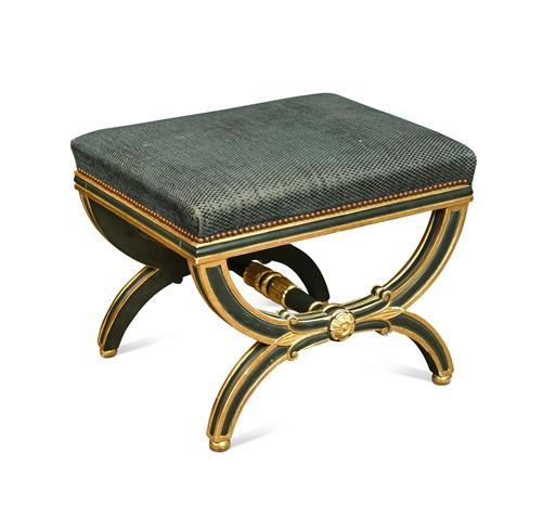 Lot 521 - A Regency style green painted and parcel gilt foot stool