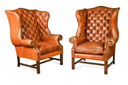 Lot 409 - A pair of George III style leather wingback armchairs, modern