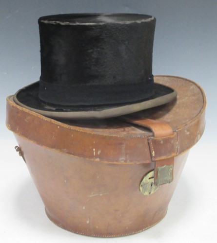 Lot 66 - A large silk top hat in leather case Internal...