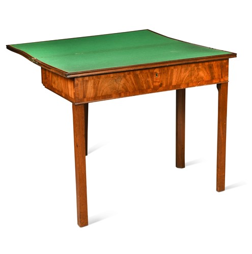 Lot 445 - A George III mahogany fold over games/writing table