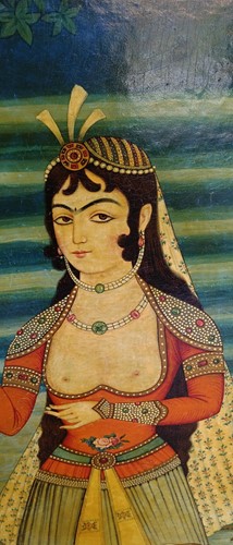 Lot 89 - A Qajar School painting of a lady in a landscape