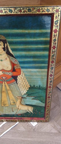 Lot 89 - A Qajar School painting of a lady in a landscape