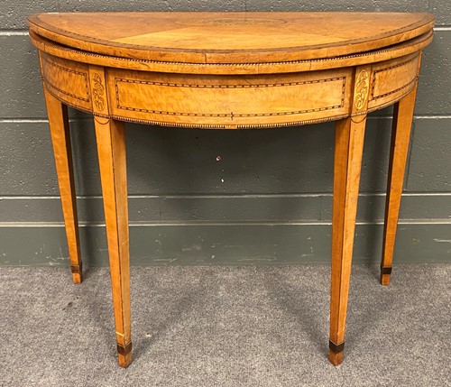 Lot 406 - A George III satinwood demi lune card table,...