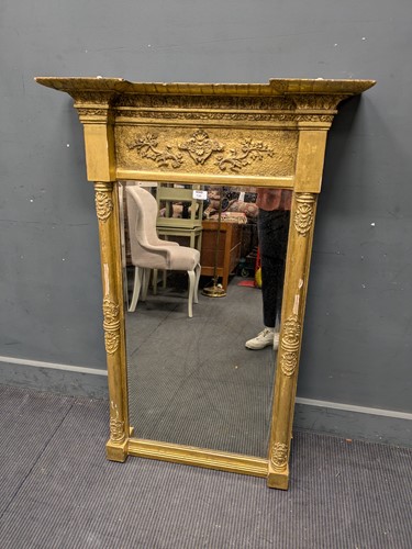 Lot 735 - A early 19th century gilt pier glass, leaf...