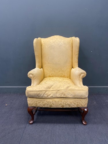 Lot 677 - George II style wingback armchair on cabriole...
