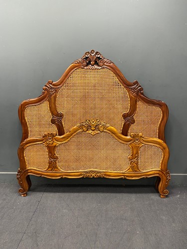 Lot 685 - A caned walnut double bedstead