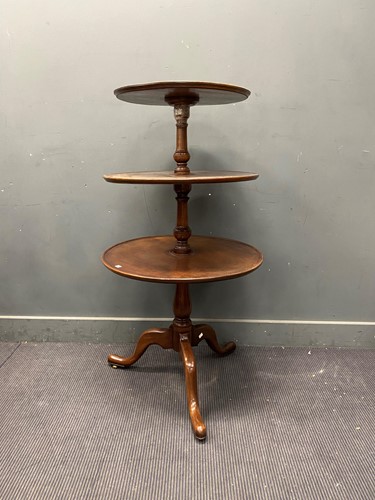 Lot 653 - George III style mahogany three tier dumb...