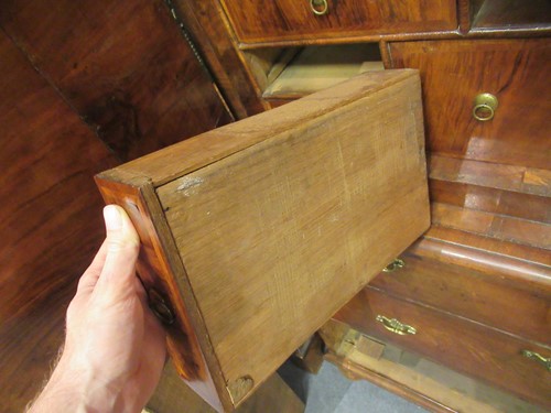 Lot 711 - A William & Mary walnut feather banded cabinet on chest, late 17th century