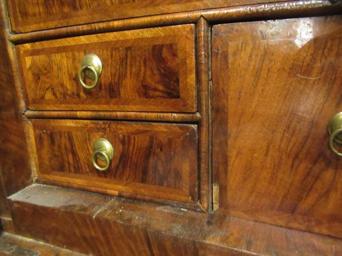Lot 711 - A William & Mary walnut feather banded cabinet on chest, late 17th century