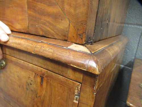 Lot 711 - A William & Mary walnut feather banded cabinet on chest, late 17th century