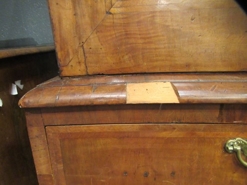 Lot 711 - A William & Mary walnut feather banded cabinet on chest, late 17th century