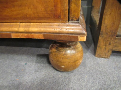 Lot 711 - A William & Mary walnut feather banded cabinet on chest, late 17th century