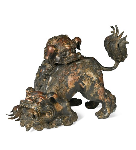 Lot 64 - A Japanese lacquered and parcel gilt bronze fighting Shishi group, late Meiji Period (1868-1912)