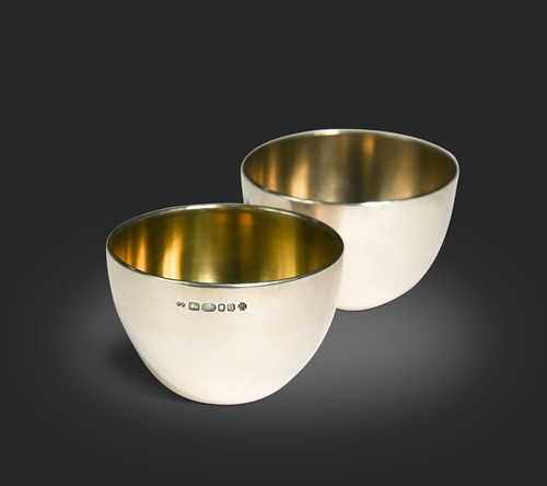 Lot 215 - Kim Harrell, a pair of contemporary silver tot cups, London, 2000