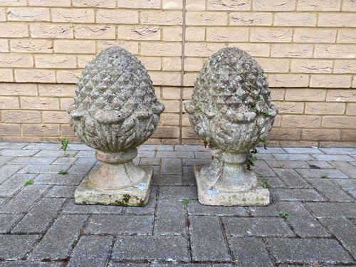 Lot 425 - A pair of composite stone finials modelled as...