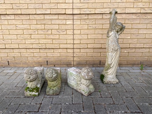 Lot 426 - Three composite stone recumbant sphinxes 28cm...