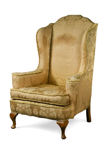 Lot 330 - A Queen Anne style beech framed wingback armchair