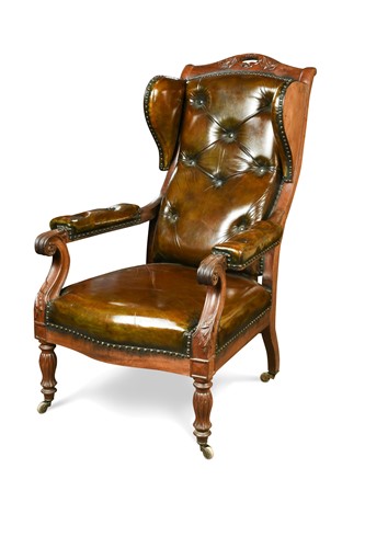 Lot 438 - A Continental mahogany wing back library arm chair, 19th century