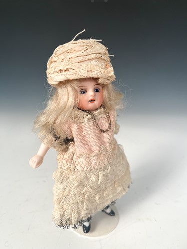 Lot 37 - A J.D. Kestner all bisque miniature mignonette closing eye doll