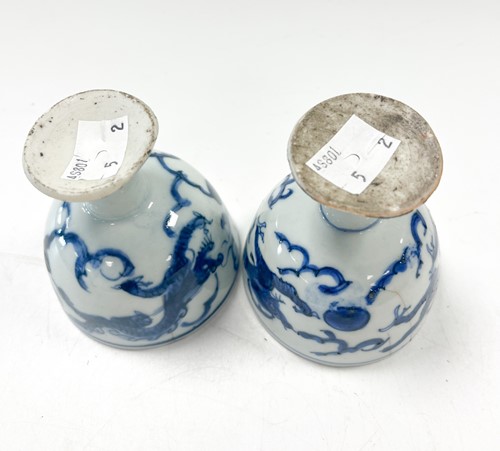 Lot 1 - Two Chinese blue and white porcelain dragon stem cups, late Ming Dynasty, circa 1600-1640