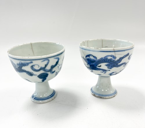 Lot 1 - Two Chinese blue and white porcelain dragon stem cups, late Ming Dynasty, circa 1600-1640