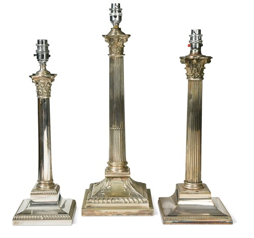 Lot 403 - A collection of three electroplate column table lamps, 20th century