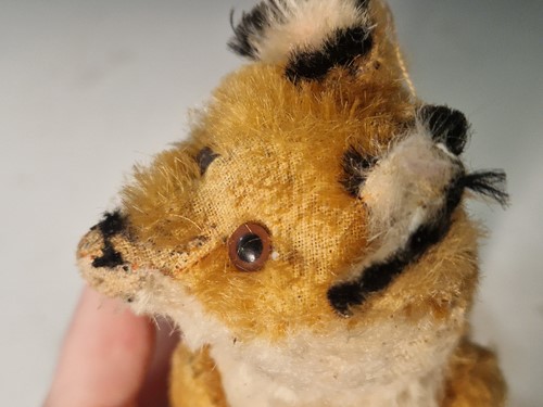 Lot 131 - A vintage Steiff toy fox on wooden wheels